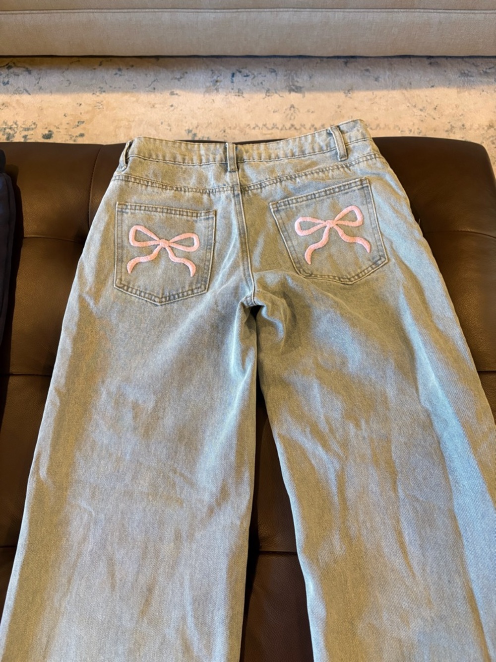 Edikted Light Wash Wide Leg Jeans with Pink Bow Back Pockets